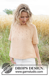 Peach Whisper Top / DROPS 268-22 - Jersey a punto con manga corta en DROPS Paris. La labor se trabaja de arriba abajo con borde enrollado, canesú redondo y patrón de calados en el canesú. Talla XS – XXXL