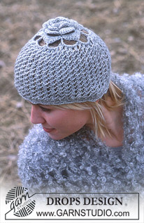 DROPS 93-23 - Hat in Karisma Superwash with crocheted flower.  Shawl in Puddel