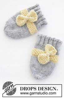 Little Miss Ribbons / DROPS Baby 31-11 - Conjunto de punto con gorro y manoplas para bebé en DROPS BabyMerino. El conjunto está tejido con punto de arroz y lazo. Tallas conjunto completo: 1 – 9 meses. Tallas gorro: prematuro – 4 años.