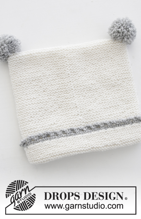 Time for Fun / DROPS Baby 31-15 - Conjunto que consiste de: Mono de punto para bebé en punto musgo con orilla a ganchillo, gorro en punto musgo con orilla a ganchillo y pompones, y calcetines. Tallas prematuro – 4 años. El conjunto está tejido en DROPS BabyMerino.