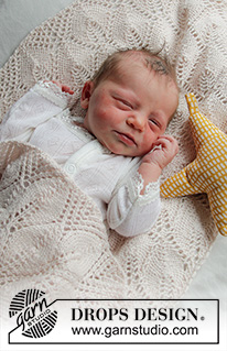 Golden Slumber / DROPS Baby 33-2 - Gestrickte Decke für Babys in DROPS BabyMerino. Die Arbeit wird als Viereck ab der Mitte nach außen mit Blattmuster gestrickt. Thema: Babydecke