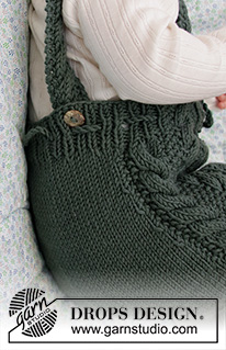 Ready to Play Romper / DROPS Baby 33-21 - Knitted play suit for baby with cables and moss stitch in DROPS Merino Extra Fine. Size 1 - 24 months.