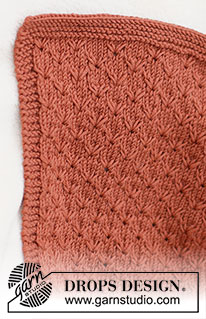 Terracotta Dreams / DROPS Baby & Children 39-6 - Prjónað teppi fyrir börn úr DROPS Merino Extra Fine. Stykkið er prjónað fram og til baka með áferðamynstri og garðaprjóni. Þema: Barnateppi.