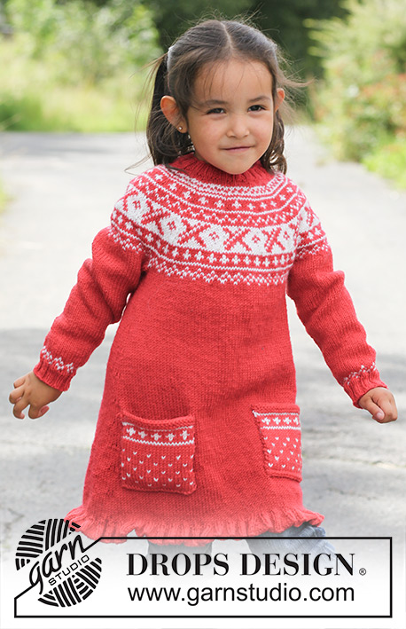 Selina / DROPS Children 22-20 - Knitted DROPS tunic worked top down in ”Karisma” with round yoke and Norwegian pattern. 
Size 3 - 12 years.
