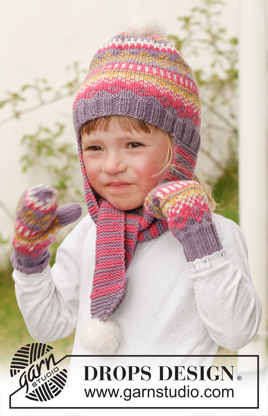 Fideli / DROPS Children 23-42 - Strikket hue med lange øreklapper og mønster i DROPS Merino Extra Fine med pomponer i DROPS Symphony og vanter med mønster i DROPS Merino Extra Fine til børn str 3 - 12 år.