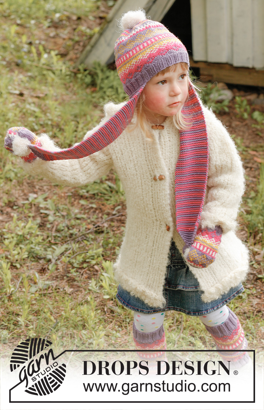 Fideli / DROPS Children 23-42 - Strikket hue med lange øreklapper og mønster i DROPS Merino Extra Fine med pomponer i DROPS Symphony og vanter med mønster i DROPS Merino Extra Fine til børn str 3 - 12 år.
