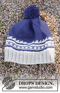 Little Adventure Set / DROPS Children 27-33 - Set of knitted hat with multi-coloured pattern and pompom, plus neck warmer with twist and English rib in DROPS Merino Extra Fine. Size children 3 - 12 years