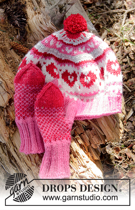 Warmhearted Hat / DROPS Children 27-4 - Bonnet tricoté avec jacquard et pompon, en DROPS Merino Extra Fine. Pour enfant, du 1 au 6 ans