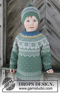 Seiland Jumper / DROPS Children 30-5 - Conjunto que consiste de: Pulóver para niños con canesú redondo y patrón de jacquard nórdico, tejido de arriba para abajo. Gorro con patrón de jacquard nórdico y pompón. Talla 2 – 12 años. El conjunto es tejido en DROPS Merino Extra Fine.