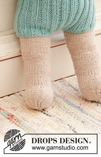 Cora / DROPS Children 35-12 - Knitted doll with short pants and tube socks. The doll is worked top down in stocking stitch with 2 strands DROPS BabyMerino or 1 strand  DROPS Big Merino, and DROPS Cotton Merino. Short pants and tube socks are worked in rib with 1 strand DROPS BabyMerino.