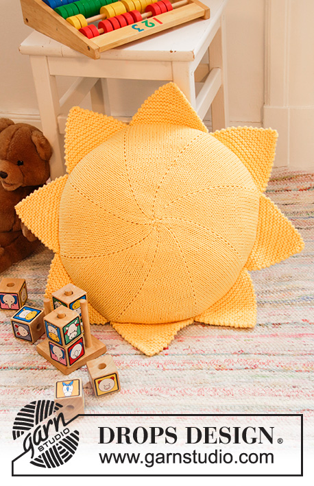 Sunny Nap Pillow / DROPS Children 35-3 - Slunce - povlak na kruhový polštář pletený z příze DROPS Paris.