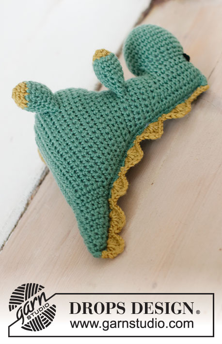 Bob the Dinosaur / DROPS Children 37-21 - Crocheted T-Rex dinosaur in DROPS Merino Extra Fine. The piece is worked from nose to tail with one seam. Theme: Soft toys.