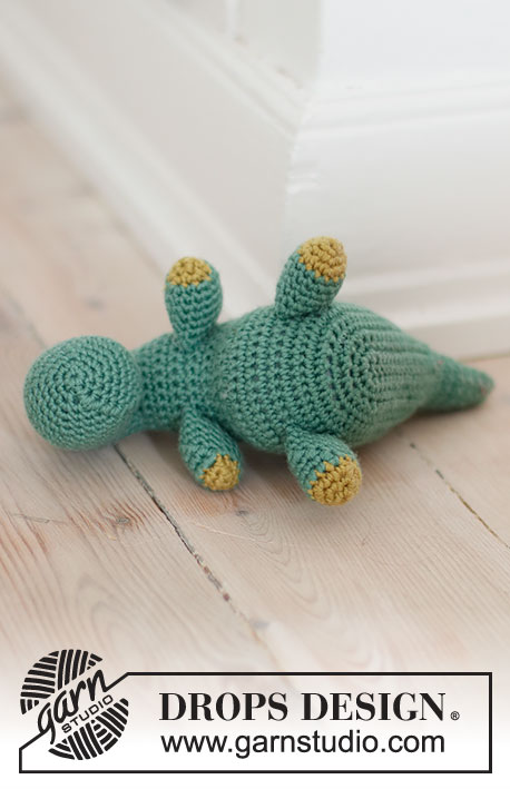 Bob the Dinosaur / DROPS Children 37-21 - Crocheted T-Rex dinosaur in DROPS Merino Extra Fine. The piece is worked from nose to tail with one seam. Theme: Soft toys.