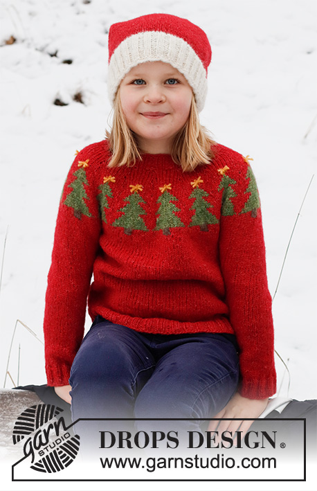 Merry Trees / DROPS Children 41-17 - Strikket Julebluse og Nissehue til børn i DROPS Air. Blusen strikkes oppefra og ned, med rundt bærestykke og juletræer. Huen strikkes i glatstrik med rib. Størrelse 2 - 14 år. Tema: Jul.