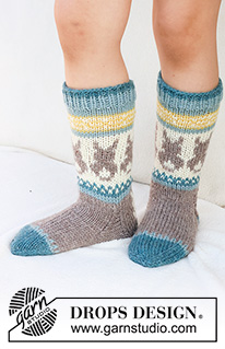 Dancing Bunny Socks / DROPS Children 41-34 - Gebreide sokken voor kinderen in DROPS Karisma. Het werk wordt van boven naar beneden gebreid in tricotsteek, met veelkleurig patroon en Paaskonijn. Maten 24 - 43. Thema: Pasen.