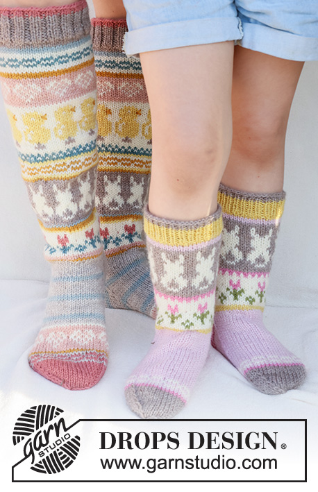 Dancing Bunny Socks / DROPS Children 41-35 - Stickade sockor till barn i DROPS Karisma. Arbetet stickas uppifrån och ner, i slätstickning med flerfärgat mönster med hare / påskhare, blomma och hjärta.
Storlek 24 - 43. Tema: Påsk.

