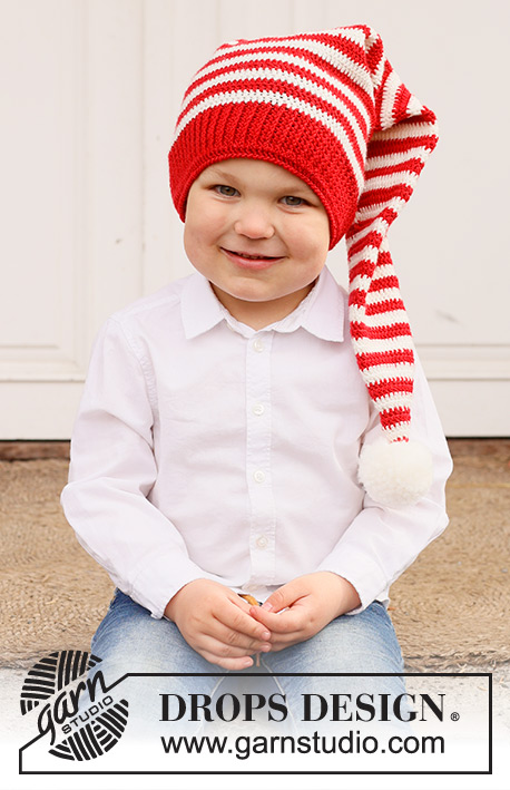Santa's Helpers / DROPS Children 44-23 - Gehäkelte Weihnachtsmütze / lange Mütze / Zipfelmütze für Kinder in DROPS BabyMerino. Die Arbeit wird von unten nach oben in Streifen gehäkelt. Thema: Weihnachten.