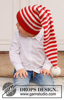 Santa's Helpers / DROPS Children 44-23 - Gehäkelte Weihnachtsmütze / lange Mütze / Zipfelmütze für Kinder in DROPS BabyMerino. Die Arbeit wird von unten nach oben in Streifen gehäkelt. Thema: Weihnachten.