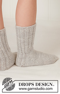 Pebble Play Socks / DROPS Children 48-23 - Knitted socks for children in DROPS Nord. The piece is worked top down, with rib. Sizes 24 - 43.