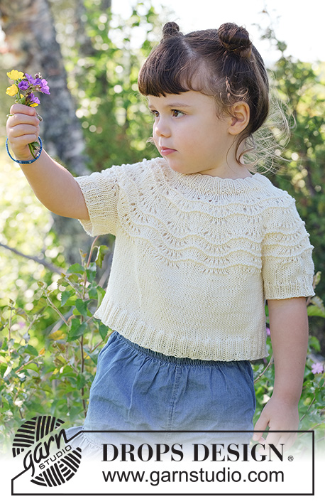 Marshmallow Morning / DROPS Children 49-1 - Stickad, kort tröja till barn i DROPS Safran eller DROPS BabyMerino. Arbetet stickas uppifrån och ner med runt ok och vågmönster. Storlek 2 – 12 år.