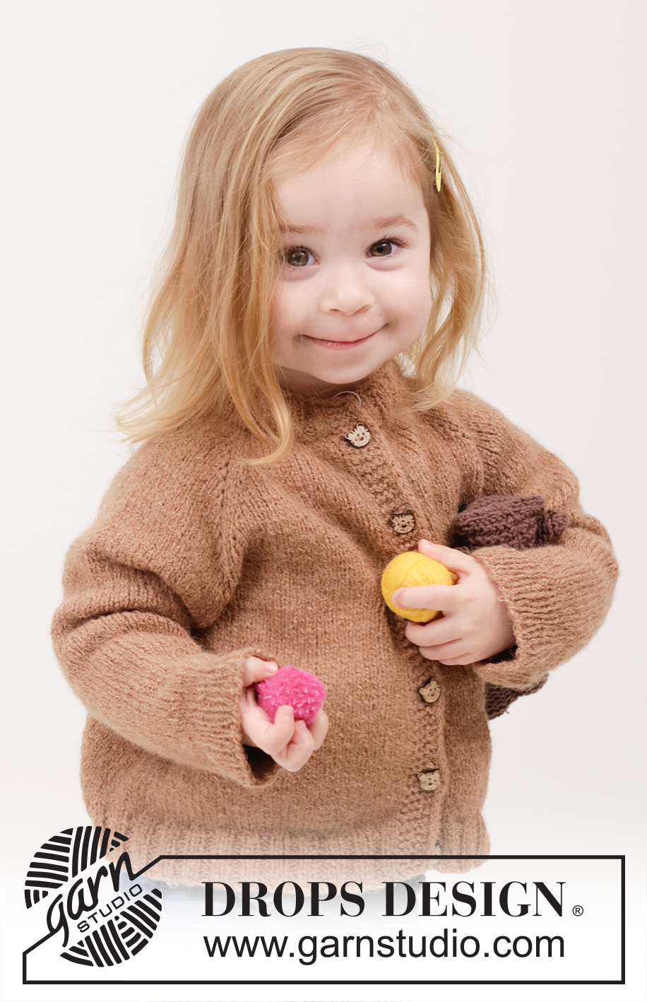 Cocoa Comfort Cardigan / DROPS Children 49-11 - Prjónuð peysa fyrir börn úr DROPS Sky. Stykkið er prjónað ofan frá og niður í sléttprjóni með laskalínu og i-cord. Stærð 2 – 12 ára.