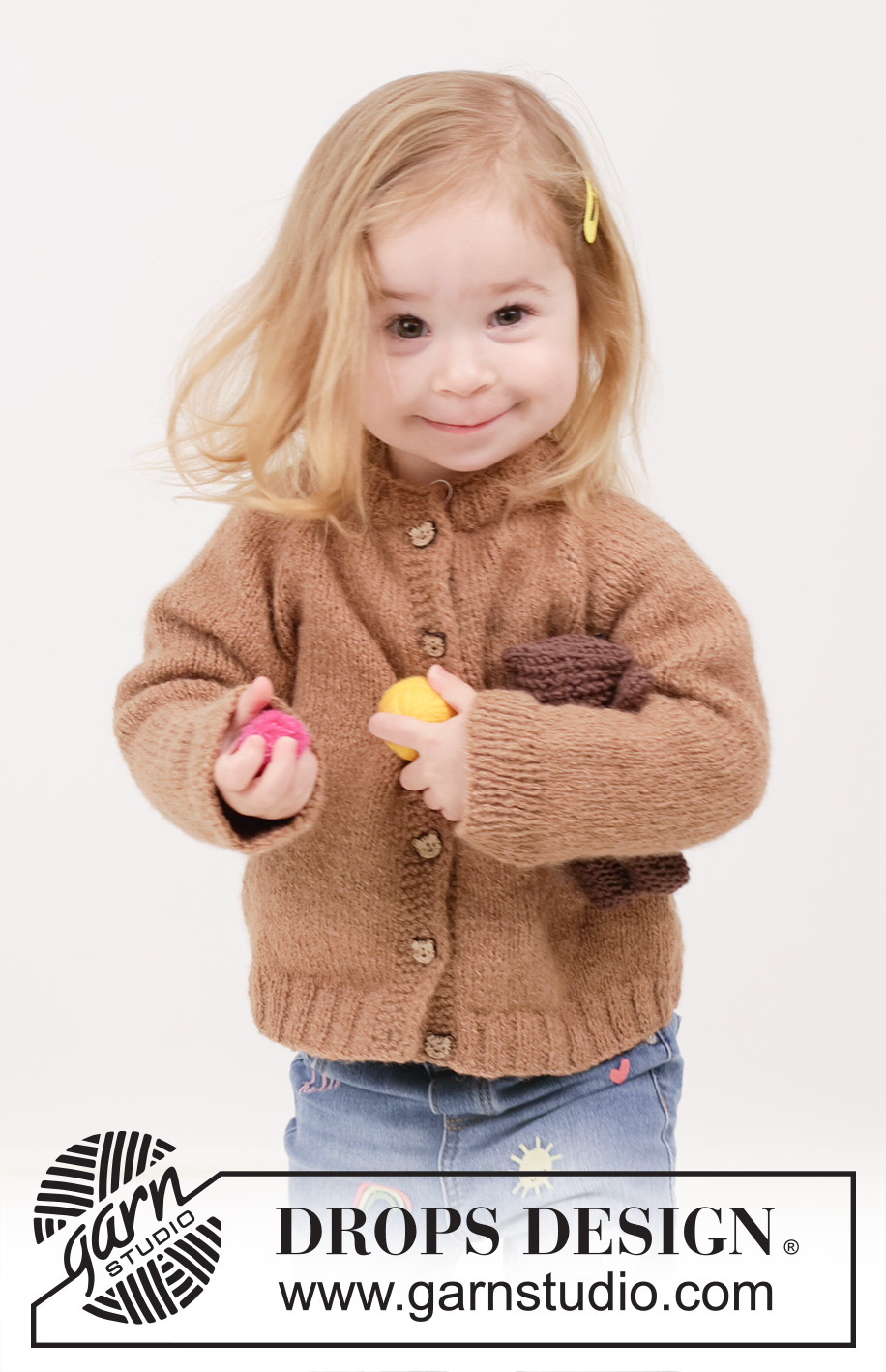 Cocoa Comfort Cardigan / DROPS Children 49-11 - Prjónuð peysa fyrir börn úr DROPS Sky. Stykkið er prjónað ofan frá og niður í sléttprjóni með laskalínu og i-cord. Stærð 2 – 12 ára.