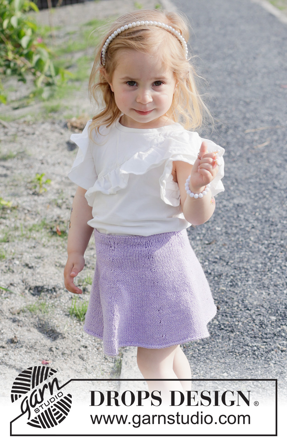 Amethyst Charm / DROPS Children 49-19 - Knitted knee-length skirt for children in DROPS Cotton Merino. The piece is worked top down in stocking stitch. Sizes 2-14 years.