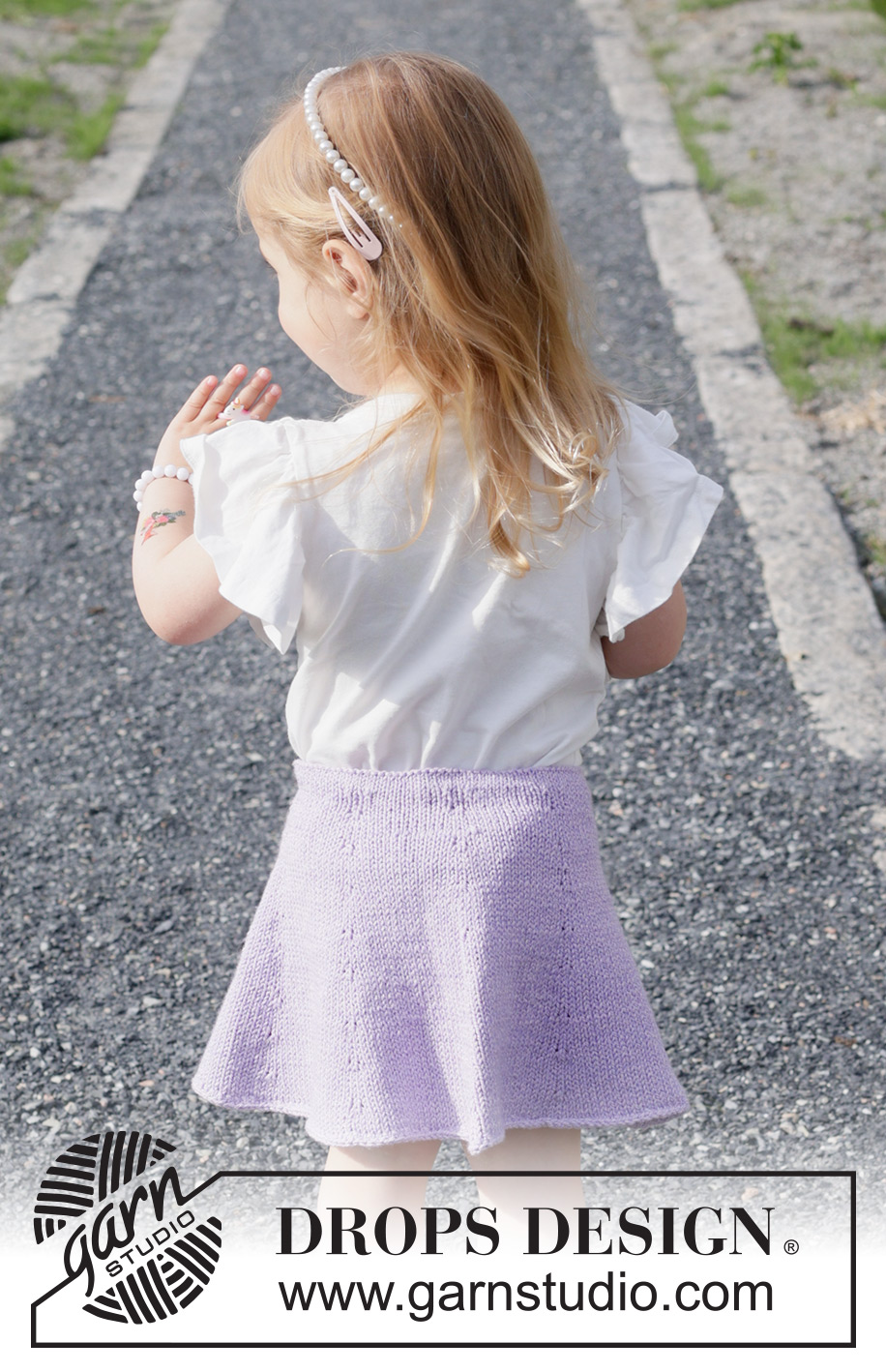 Amethyst Charm / DROPS Children 49-19 - Knitted knee-length skirt for children in DROPS Cotton Merino. The piece is worked top down in stocking stitch. Sizes 2-14 years.