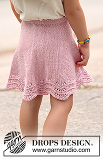 Strawberry Swirl / DROPS Children 49-20 - Knitted knee-length skirt for children in DROPS Cotton Merino. The piece is worked top down in stocking stitch, with a wave pattern. Sizes 2-14 years.