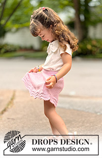 Strawberry Swirl / DROPS Children 49-20 - Knitted knee-length skirt for children in DROPS Cotton Merino. The piece is worked top down in stocking stitch, with a wave pattern. Sizes 2-14 years.