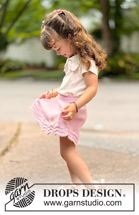 Strawberry Swirl / DROPS Children 49-20 - Knitted knee-length skirt for children in DROPS Cotton Merino. The piece is worked top down in stocking stitch, with a wave pattern. Sizes 2-14 years.
