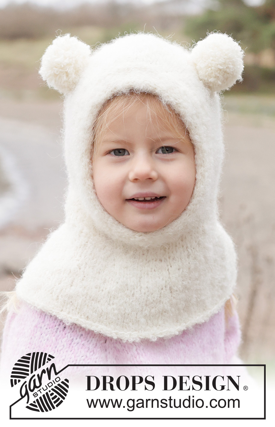 Snow Bear Balaclava / DROPS Children 50-12 - Strikket elefanthue / balaclava til børn i DROPS Alpaca Bouclé og DROPS BabyMerino. Arbejdet strikkes i glatstrik og i-cord. Størrelse 2 - 14 år.