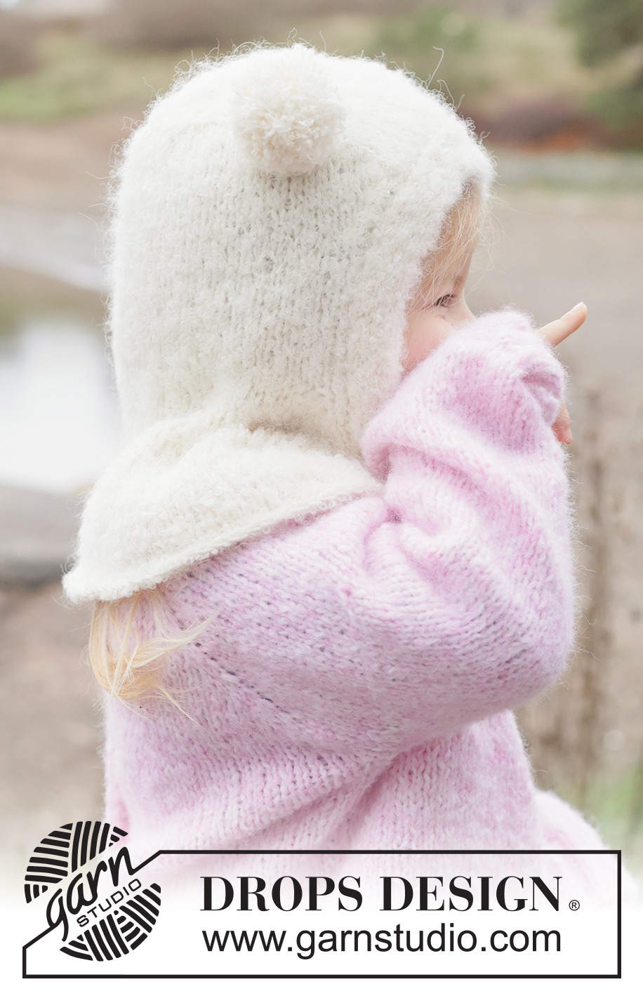 Snow Bear Balaclava / DROPS Children 50-12 - Strikket elefanthue / balaclava til børn i DROPS Alpaca Bouclé og DROPS BabyMerino. Arbejdet strikkes i glatstrik og i-cord. Størrelse 2 - 14 år.