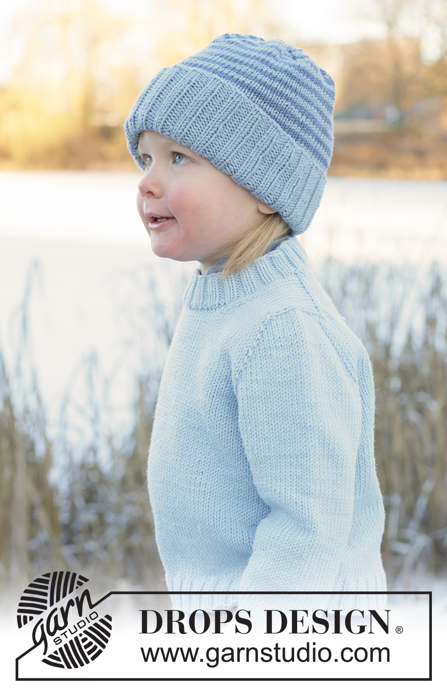 Polar Playtime Sweater / DROPS Children 50-17 - Kötött pulóver és sapka gyerekeknek DROPS Merino Extra Fine fonalból. A darabot fentről lefelé haladva kötjük, harisnyakötéssel és európai vállrésszel. A sapkát körben haladva készítjük, csíkokkal. 2 - 14 éveseknek való méretekben