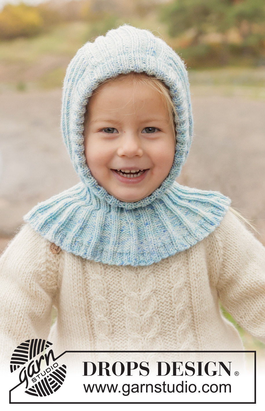 Crystal Chill Balaclava / DROPS Children 50-18 - Strikket elefanthue / balaclava til børn i DROPS BabyMerino. Arbejdet strikkes nedefra og op i rib. Størrelse 2 - 14 år.