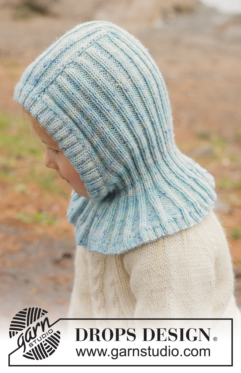 Crystal Chill Balaclava / DROPS Children 50-18 - Strikket elefanthue / balaclava til børn i DROPS BabyMerino. Arbejdet strikkes nedefra og op i rib. Størrelse 2 - 14 år.