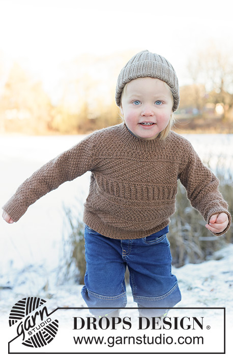 Woodland Wander Sweater / DROPS Children 50-9 - Pull et bonnet tricotés pour enfant en DROPS Lima. Le pull se tricote de haut en bas, avec épaules européennes / épaules biaisées et point fantaisie relief. Le bonnet se tricote en rond, en côtes. Du 2 au 14 ans.