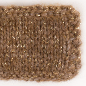 Swatch of DROPS Air 49, acorn 
														+ DROPS Glitter 01, gold + DROPS Kid-Silk 51, toffee