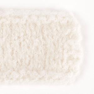 Swatch of DROPS Alpaca Bouclé 0100, off white 
														+ DROPS Melody 01, off white