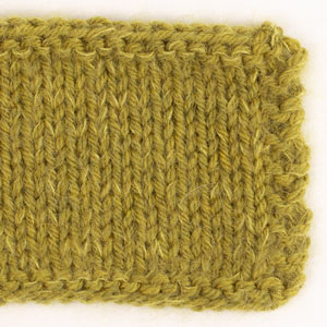 Swatch of DROPS Daisy 31, olive oil 
														+ DROPS Kid-Silk 67, bright olive