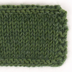 Swatch of DROPS Kid-Silk 19, dark green 
														+ DROPS Merino Extra Fine 52, green leaf