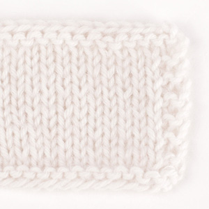 Swatch of DROPS Kid-Silk 38, chalk 
														+ DROPS Lima 1101, white