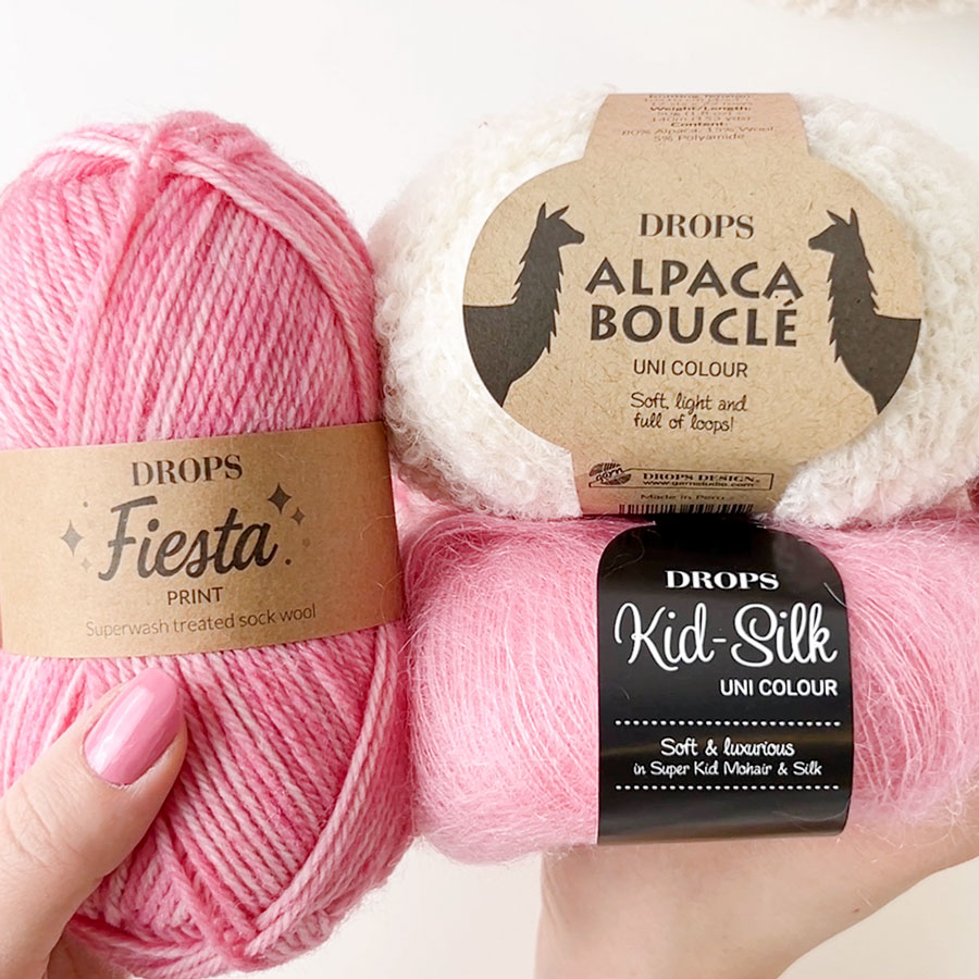 Yarn combinations skeins of DROPS Alpaca Bouclé 0100, off white 
											+ DROPS Fiesta 32, strawberry ice cream + DROPS Kid-Silk 62, strawberry ice cream