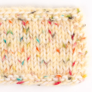 Swatch of DROPS Brushed Alpaca Silk 30, yellow 
														+ DROPS Fiesta 27, winter carnival