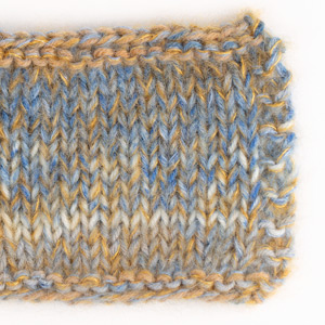 Swatch of Fabel 910, sea mist																	+ DROPS Kid-Silk 08, light jeans blue+ DROPS Kid-Silk 30, curry